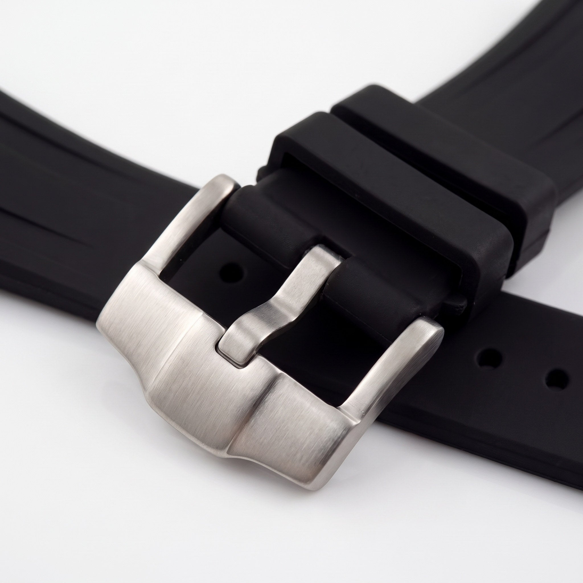 Close-up of the brushed stainless steel pin buckle on the Apex rubber watch strap