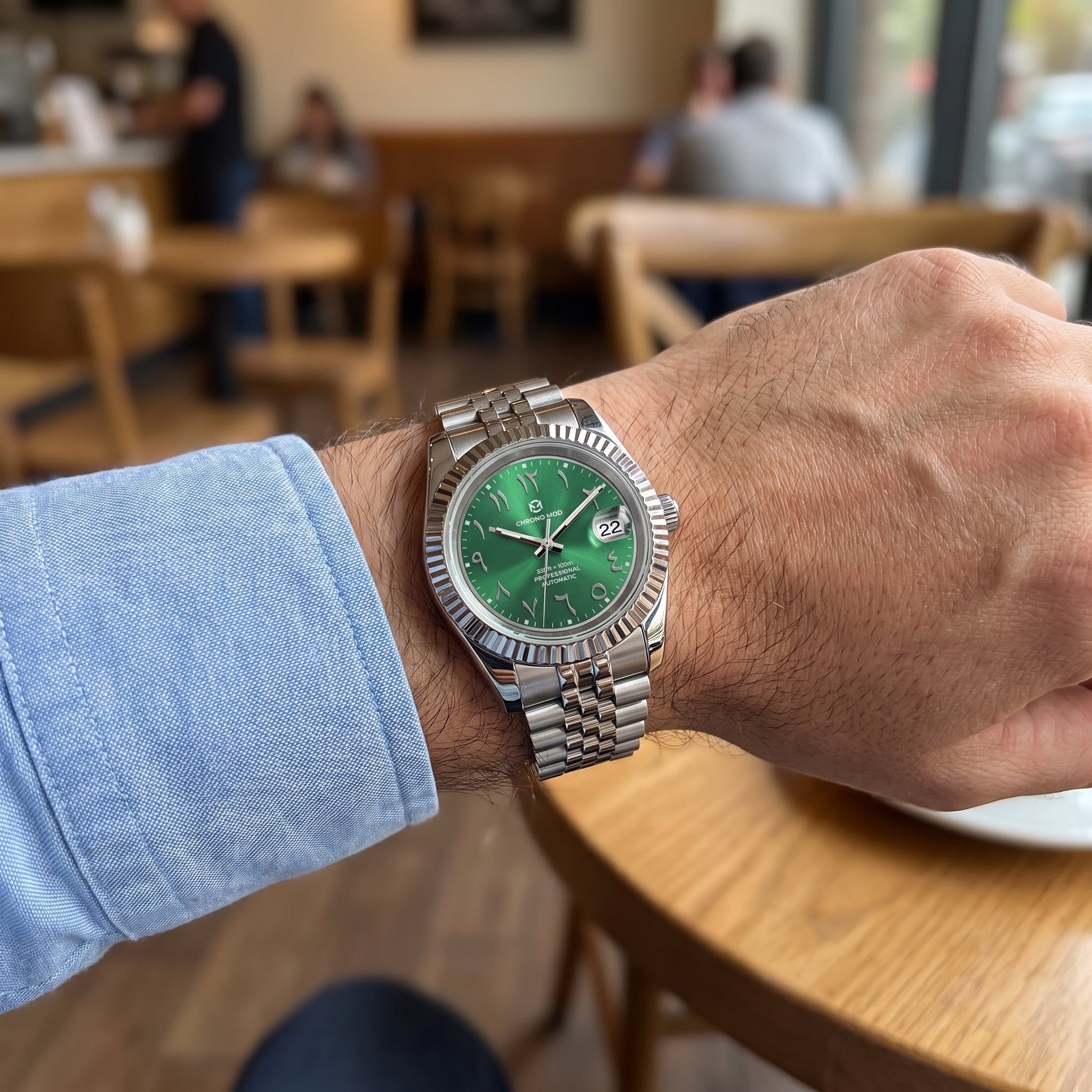 Chrono Mod Classic Date green Arabic dial worn on the wrist, natural light