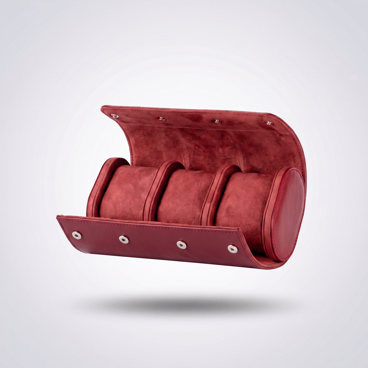 Burgundy Red leather watch roll for three watches, open, showing the red suede cushions