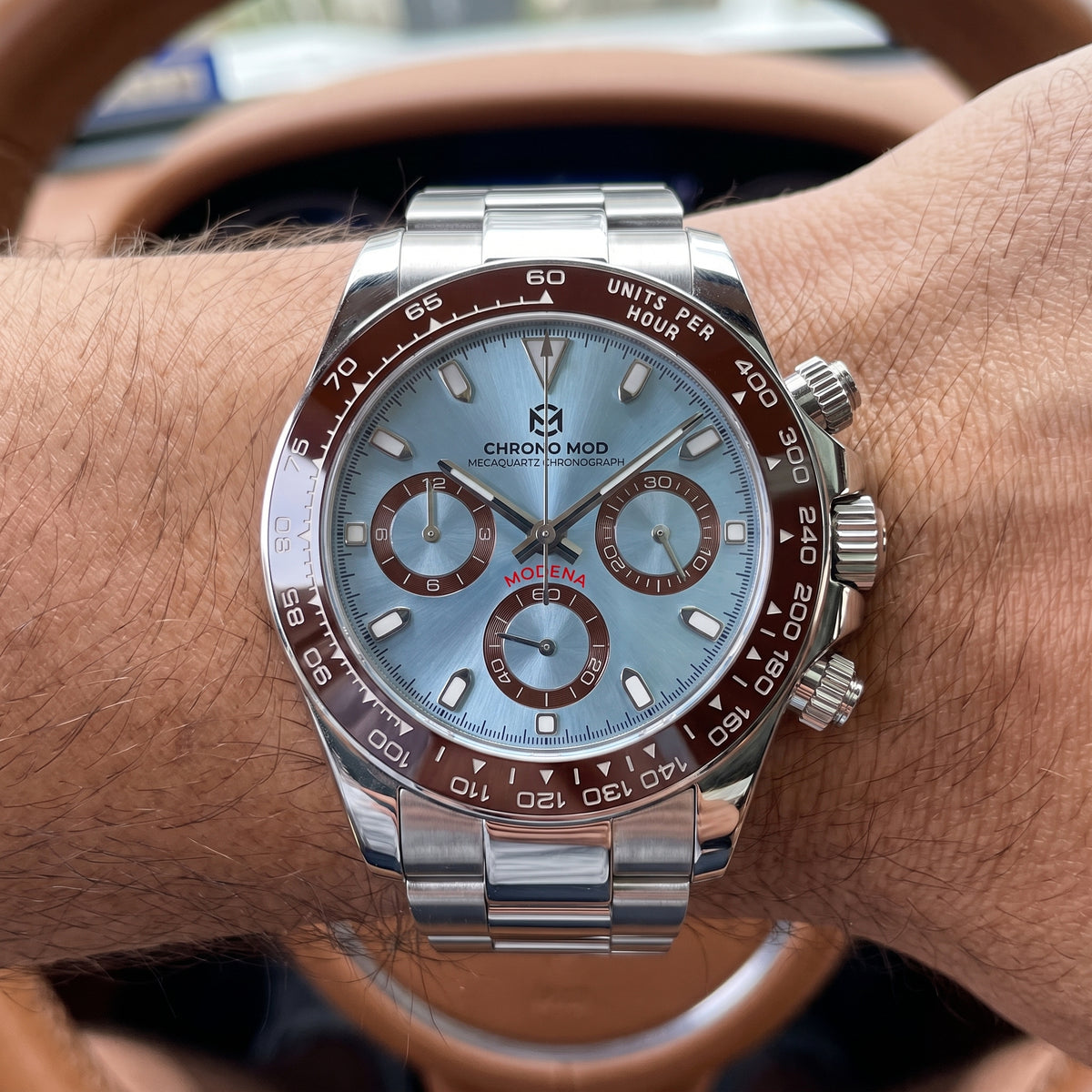 Chrono Mod Modena chronograph worn on the wrist at the wheel, natural light