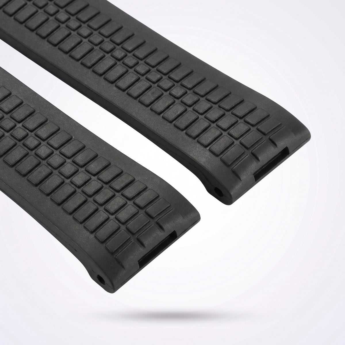 The two straight-cut 21 mm rubber ends of the Odyssey strap, with the moulded spring bar channel that drops straight into the lugs