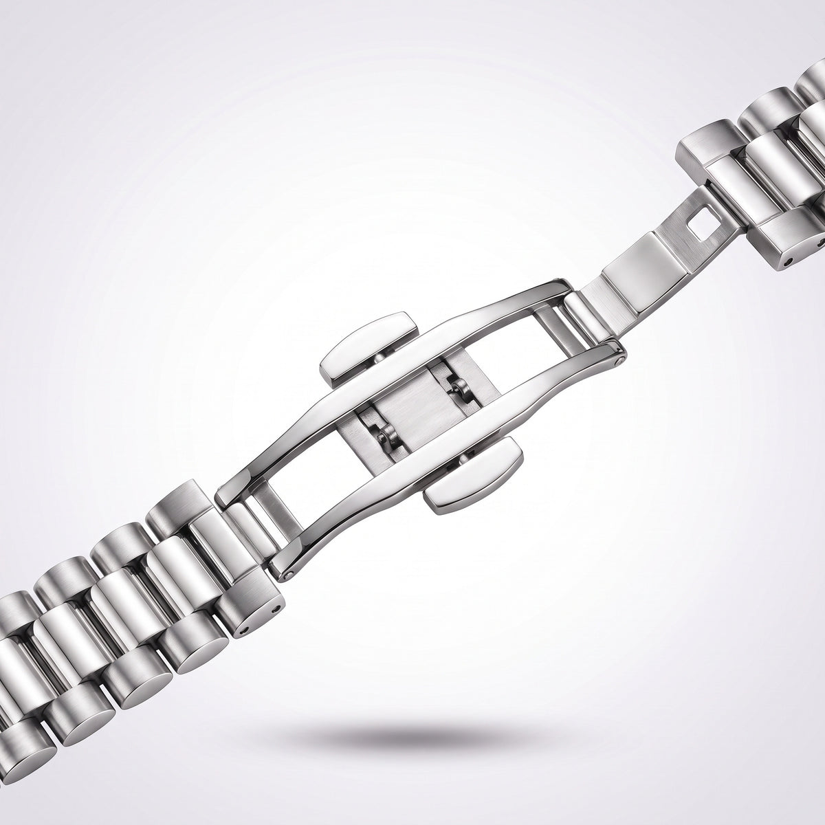 Close-up of the concealed butterfly clasp opened out, showing the two mirrored arms and the central hinge